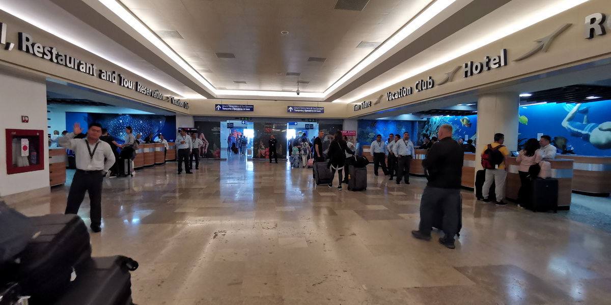Walk to the exit doors at the end of the arrivals hall